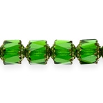 Cylinder-shaped faceted glass beads with metallic details, 9mm