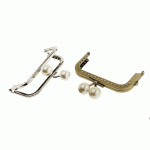 Twin hinged metal interchangeable bag frame, bag fastening with pearl knobs 