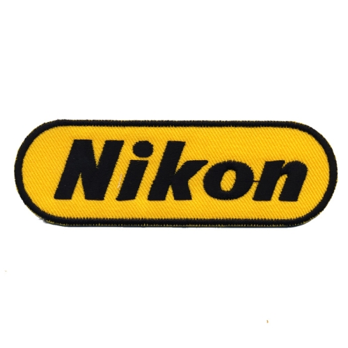 Triigitav aplikatsioon, Fototehnika kaubamärk "Nikon" logo 10 x 3,3 cm