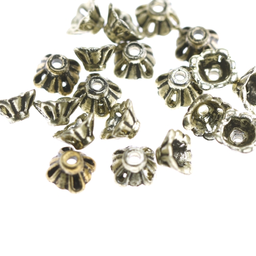 Kübarakujulised, antiikse reljeefse mustriga, metalse tooniga plastikhelmed 7 x 5mm